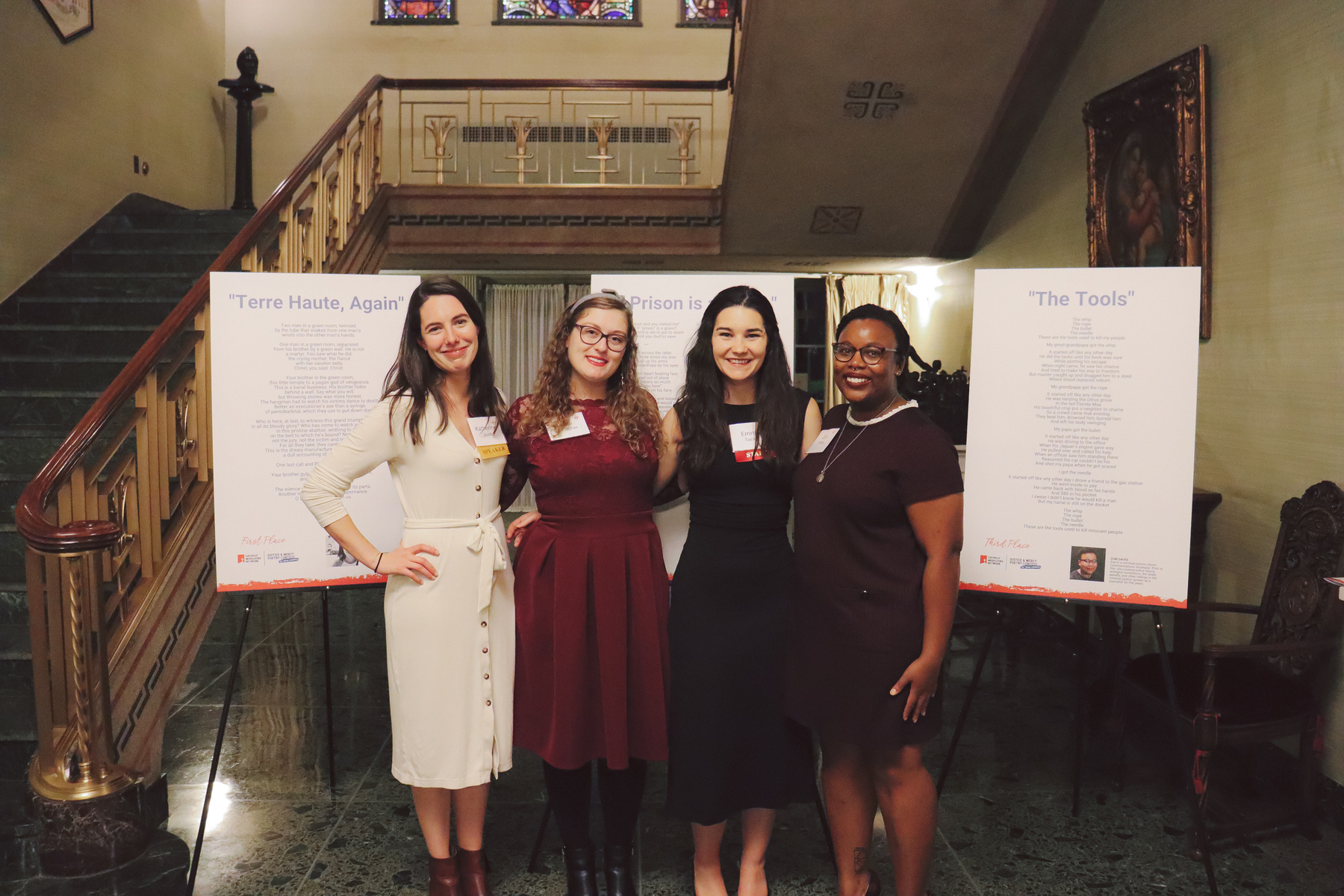 CMN Director of Community Engagement Emma Tacke stands with the 3 winners of CMN's 2022 poetry contest for young Catholics